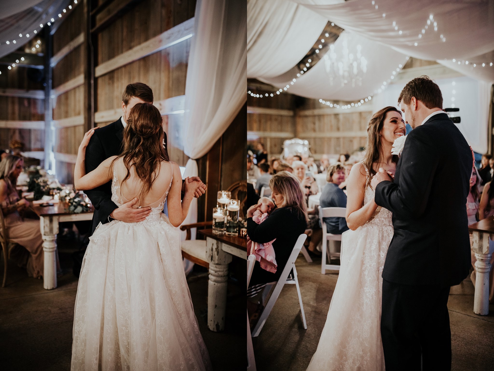 Bride and groom have their first dance in front of friends and family in a rustic barn