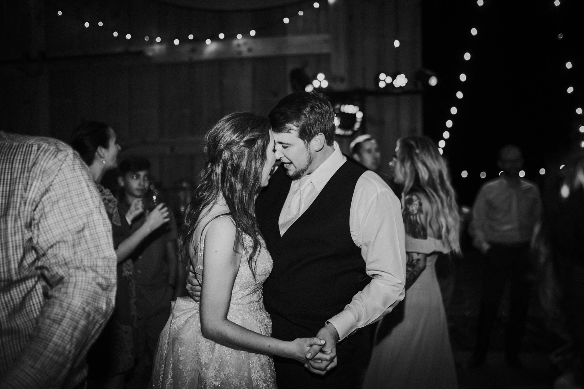 black and white image of Ashley and Clifford dancing at their reception