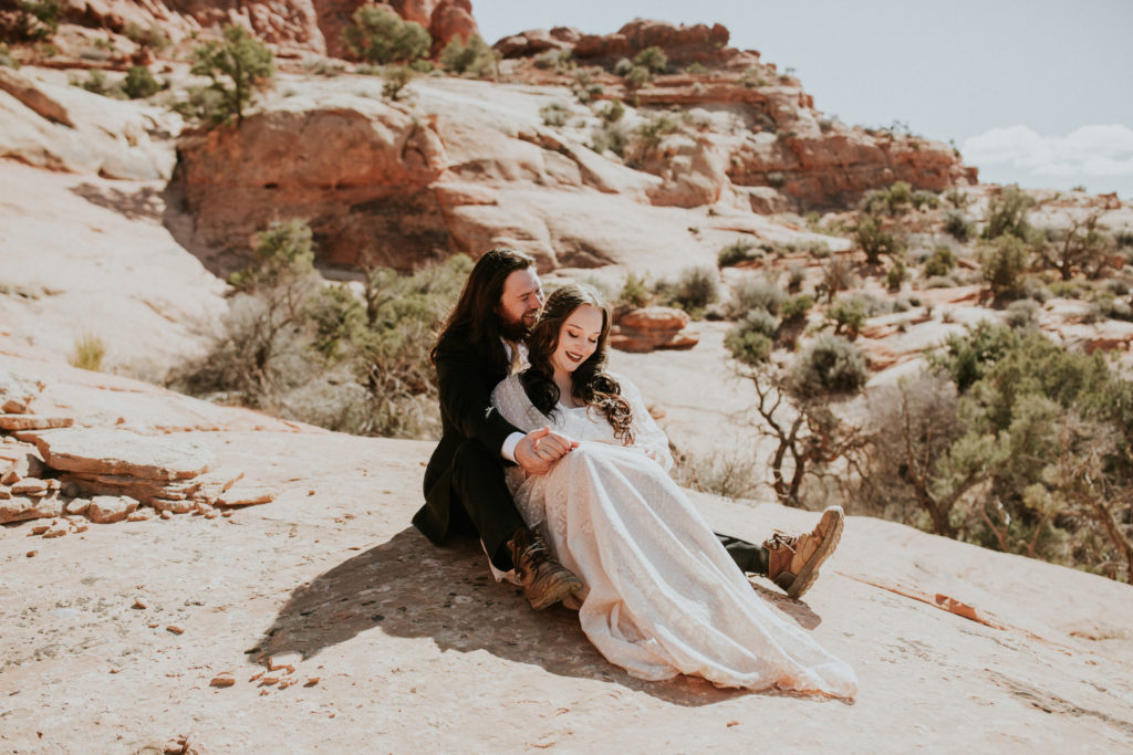 Couple cuddling together in the desert