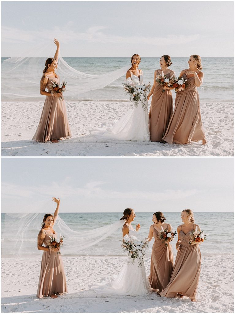 Bridesmaid frolics with bride's veil blowing in the wind