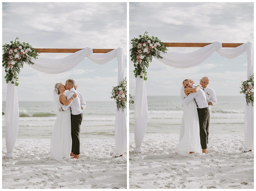 First kiss by husband and wife at their miramar beach wedding