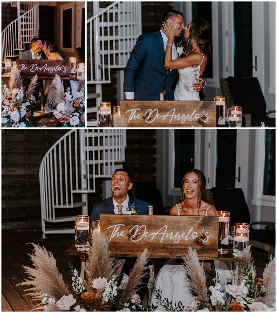 The couple sit at their sweetheart table and laugh with their guests