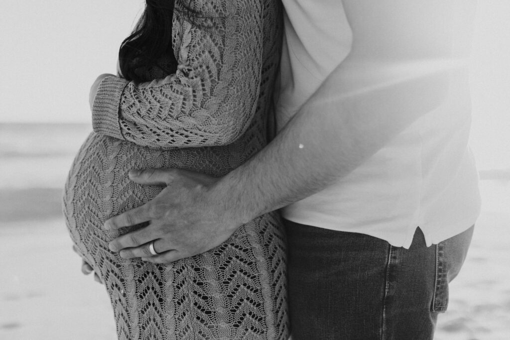 Black and white photo of a baby bump