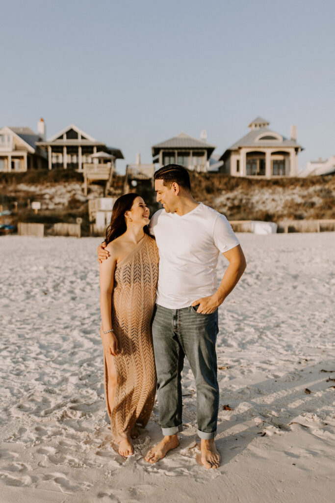 Couple on the beach during their destin maternity photography session