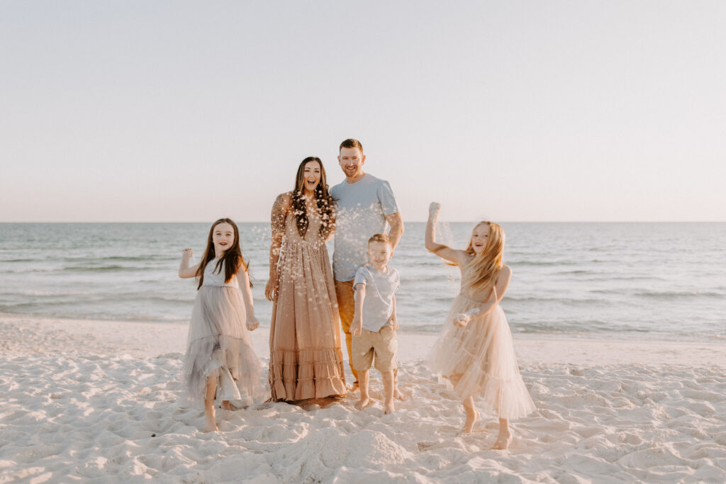 Kids throwing sand on the beach