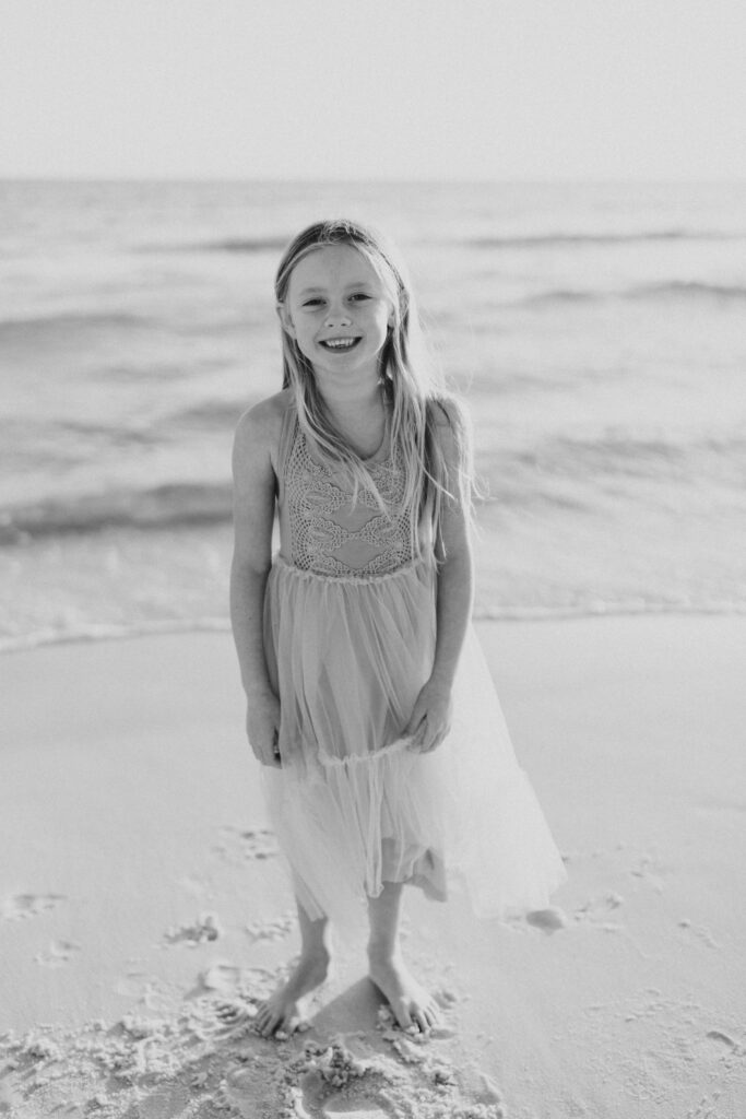 Black and white portrait of child on the beach