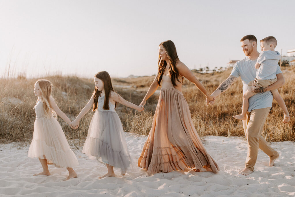 Family walking in the sand dunes of sunnyside florida