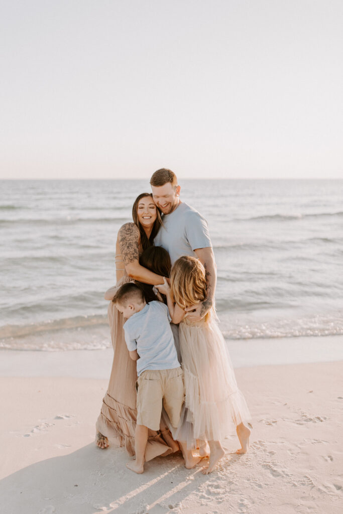 Family hugging during their sunnyside photography session